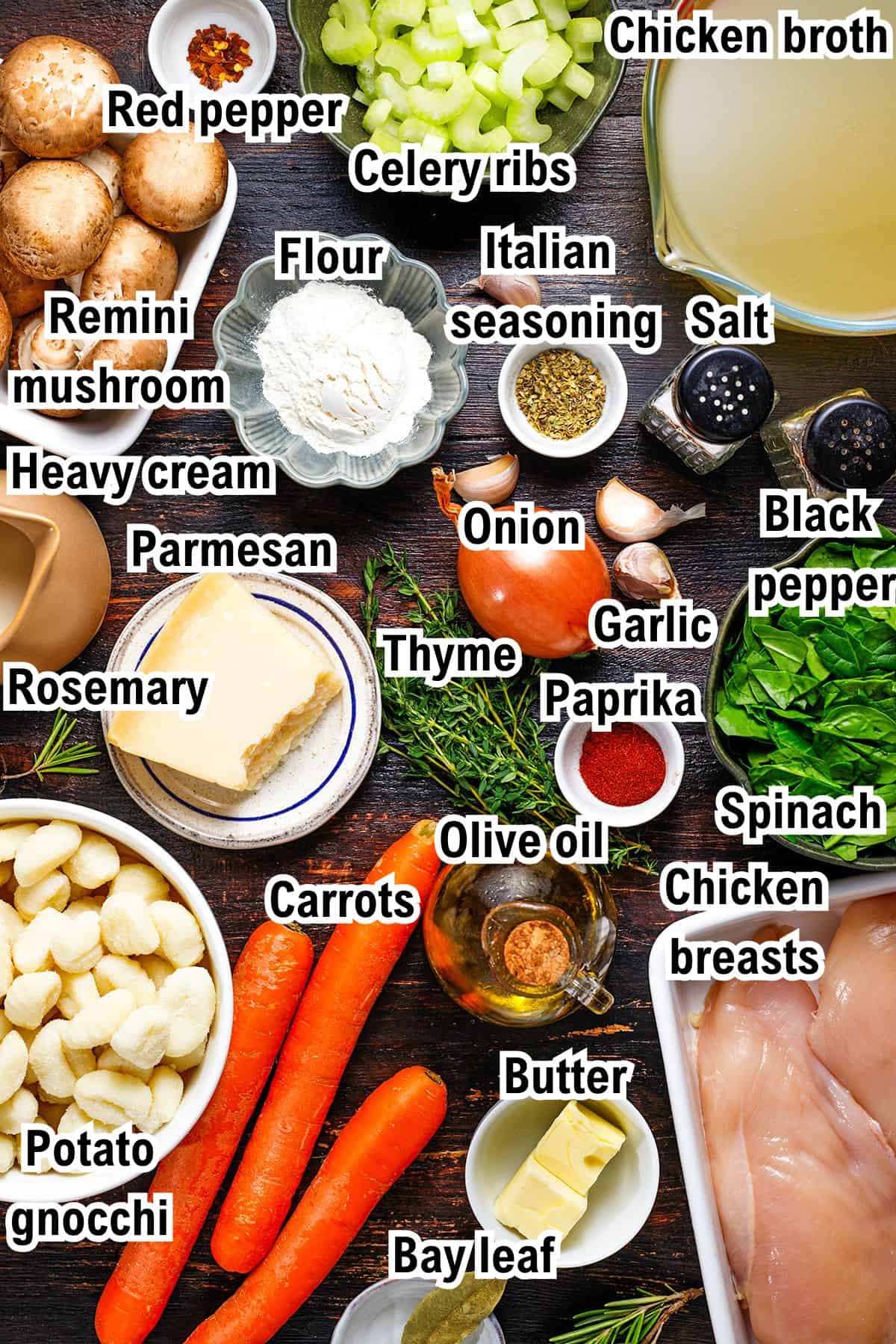 The Ingredients for Chicken Gnocchi Soup This photo shows the ingredients for Chicken Gnocchi Soup, including chicken breasts, potato gnocchi, carrots, spinach, mushrooms, parmesan, herbs, flour, seasoning, onion, garlic, broth, olive oil, heavy cream, and butter.