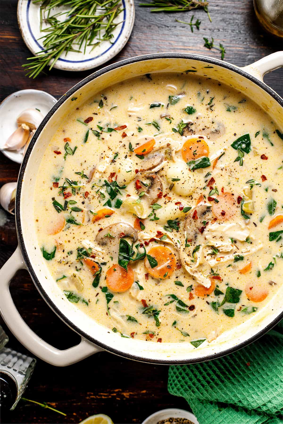 Chicken Gnocchi Soup A creamy soup with shredded chicken, sliced carrots, mushrooms, spinach, and herbs.