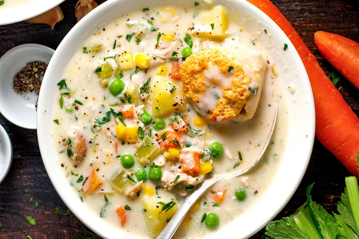 Chicken Pot Pie Soup A bowl of creamy vegetable soup with peas, corn, carrots, and potatoes.