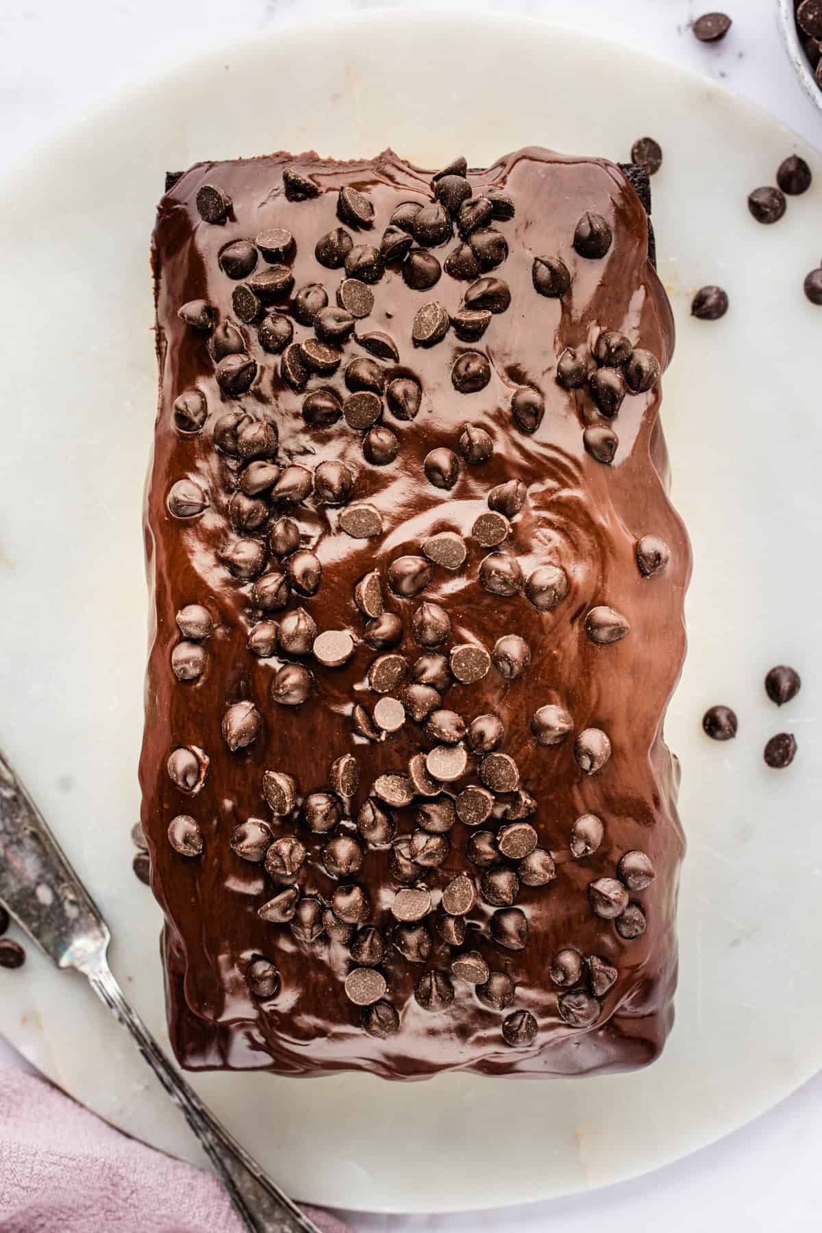Chocolate Loaf Cake A rectangular chocolate loaf cake topped with glossy chocolate frosting.