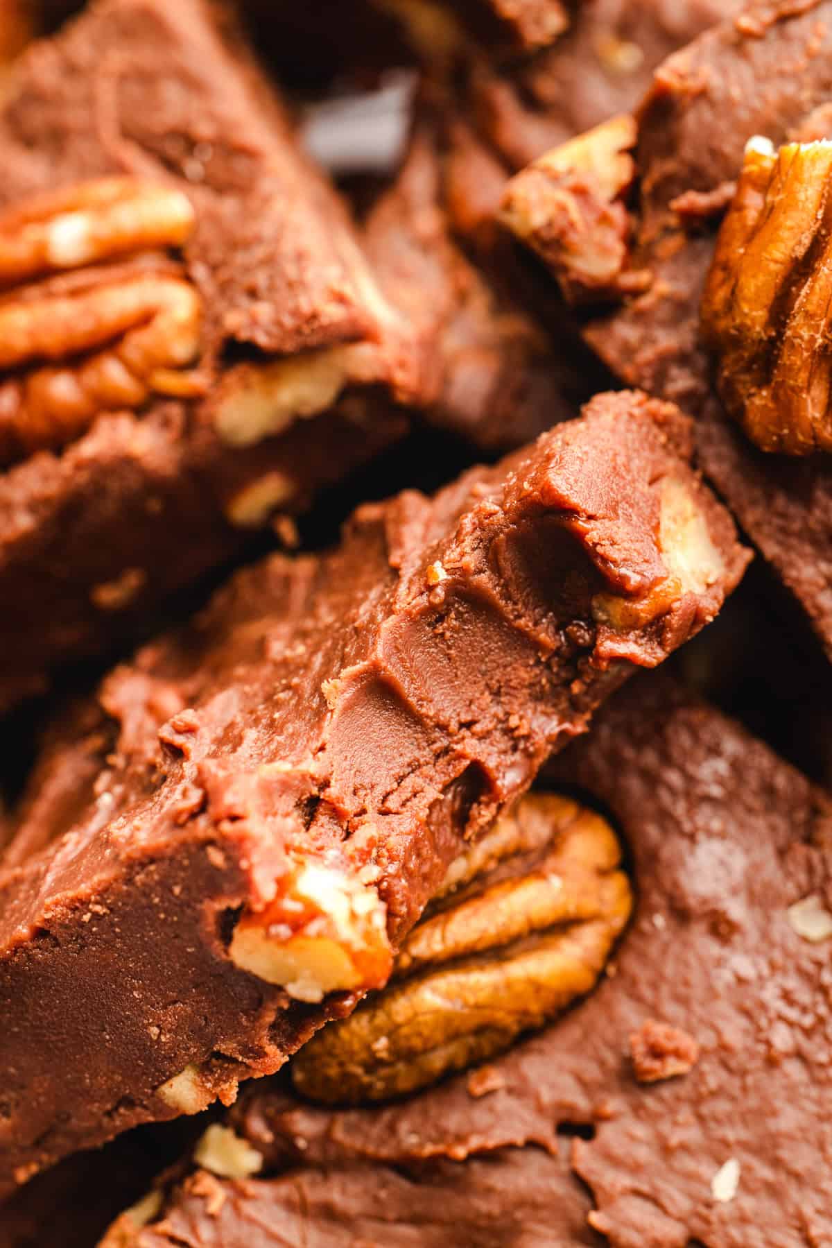 Fantasy Fudge Close-up of chocolate fudge squares with visible pecan halves.