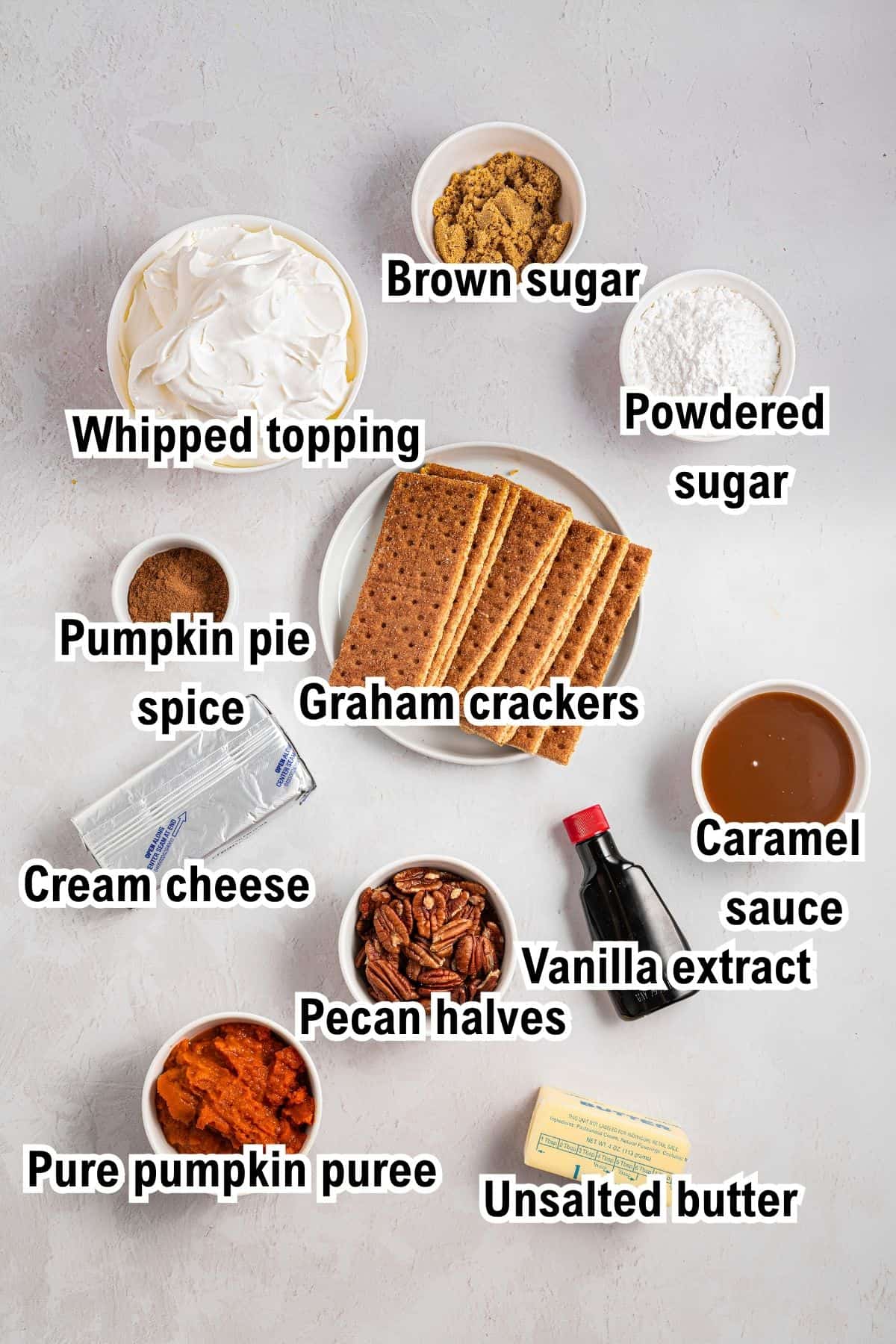 The Ingredients for Pumpkin Pie This photo shows the ingredients for Turtle Pumpkin Pie, including whipped topping, brown sugar, powdered sugar, pumpkin pie spice, graham crackers, caramel sauce, cream cheese, vanilla extract, pumpkin puree, pecans, and butter.