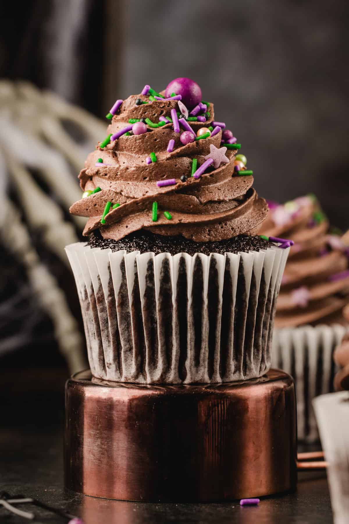 Halloween Cupcakes Chocolate cupcake with chocolate frosting and colorful star and sprinkle decorations.